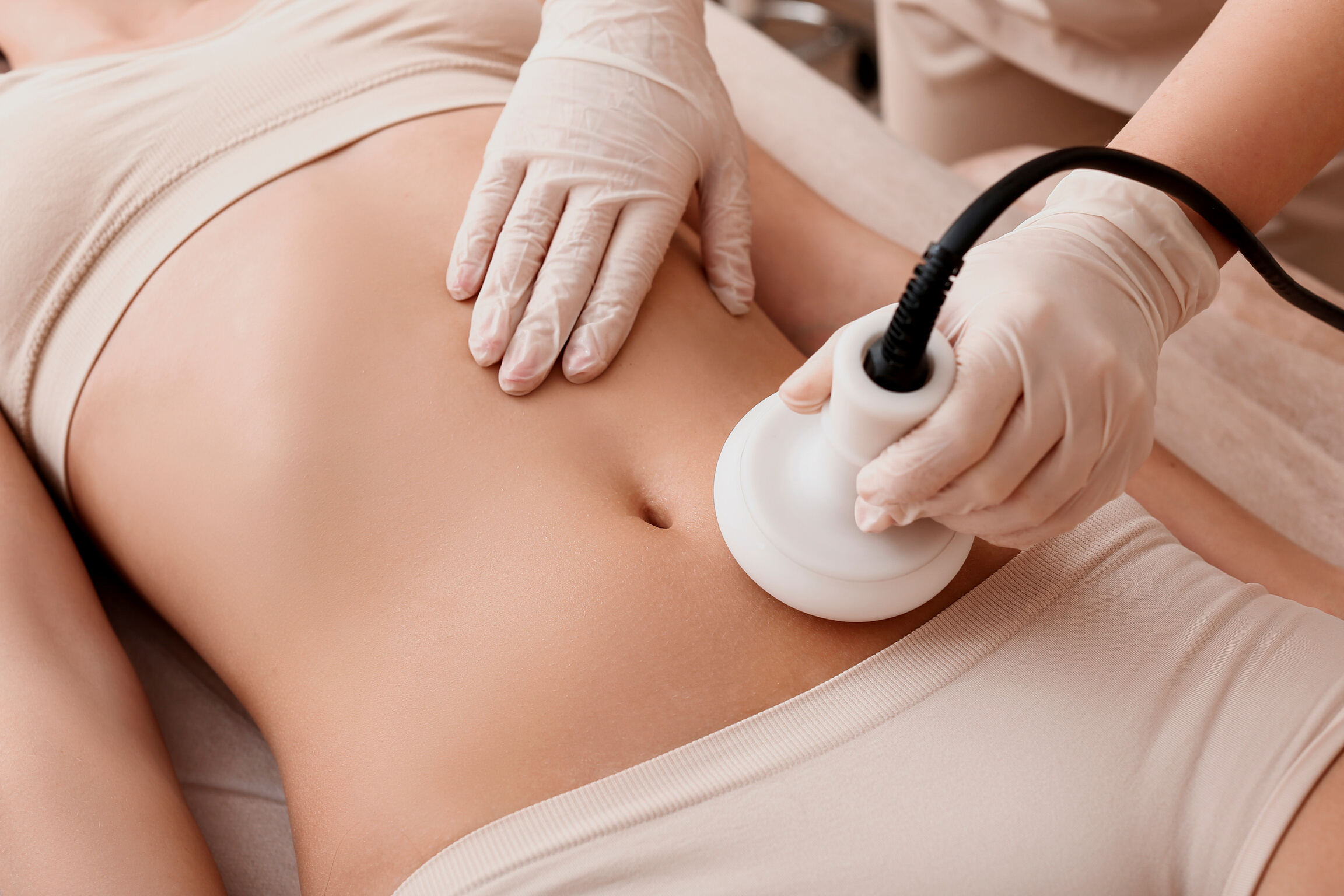 Beautiful Woman Undergoing Procedure of anti-Cellulite Massage in Beauty Salon, Closeup